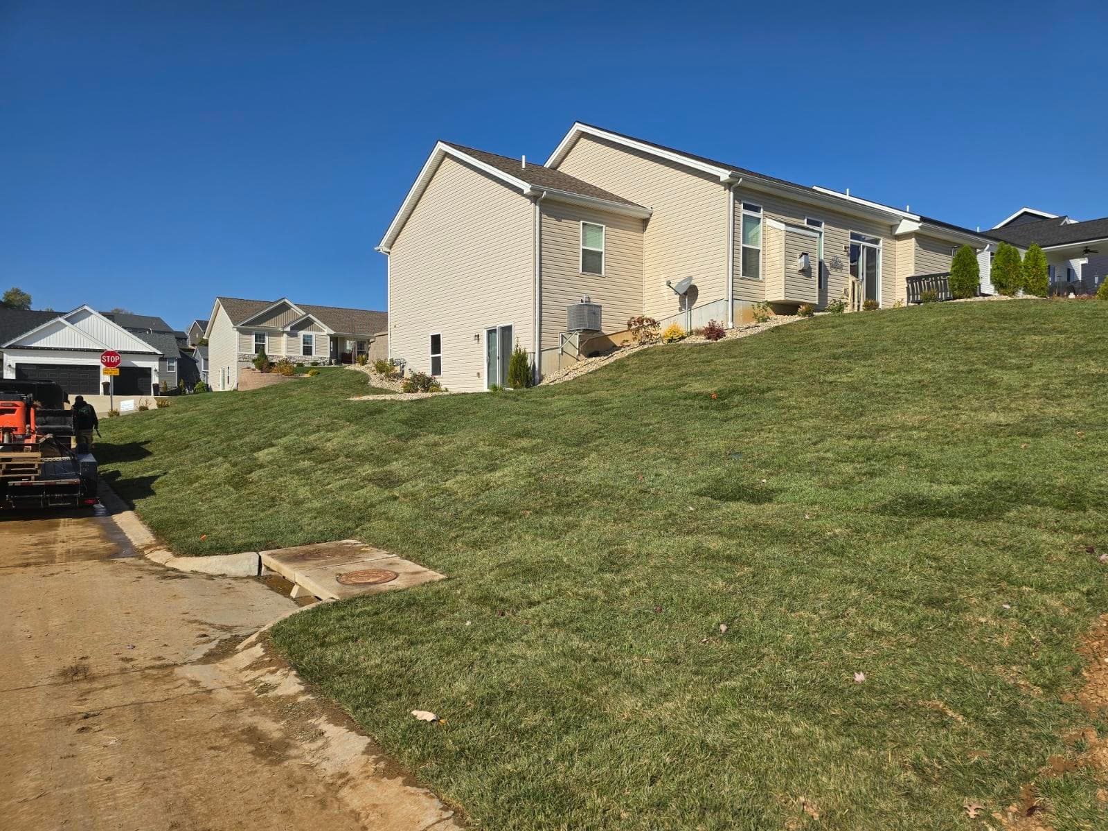 Sloped Yard Transformation with New Sod Installation image