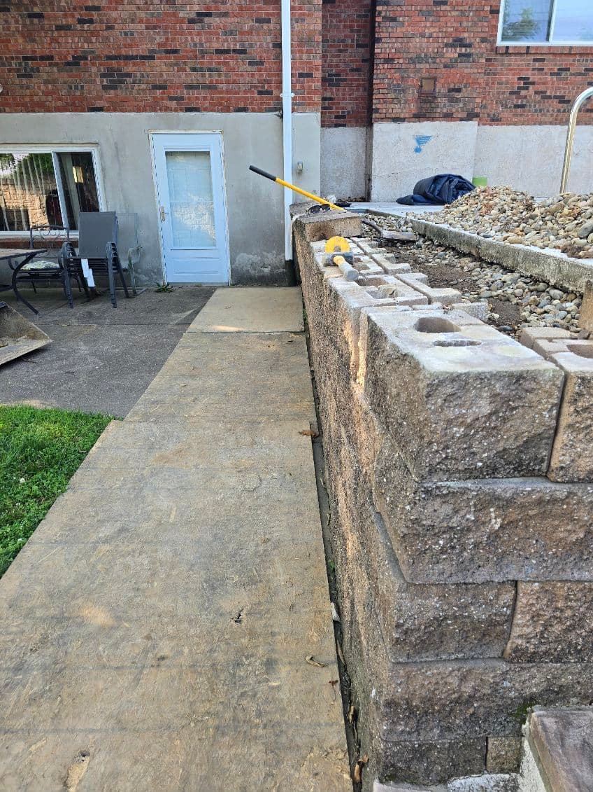 Transformative Wall Rebuild with Expert Drainage image