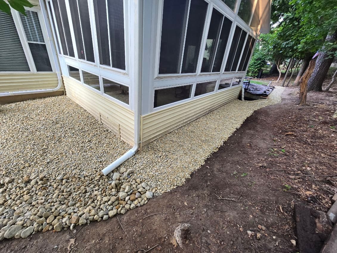 French Drain Installation with Decorative Rock image